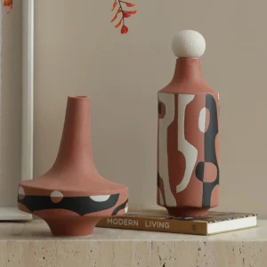 Simple, modern, creative black and white painted red ceramic art ornament for living room TV cabinet, entryway tabletop, vase decoration.